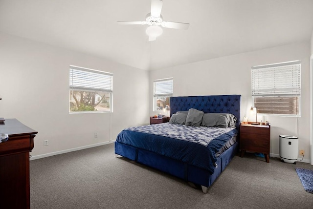 carpeted bedroom featuring lofted ceiling, ceiling fan, and baseboards