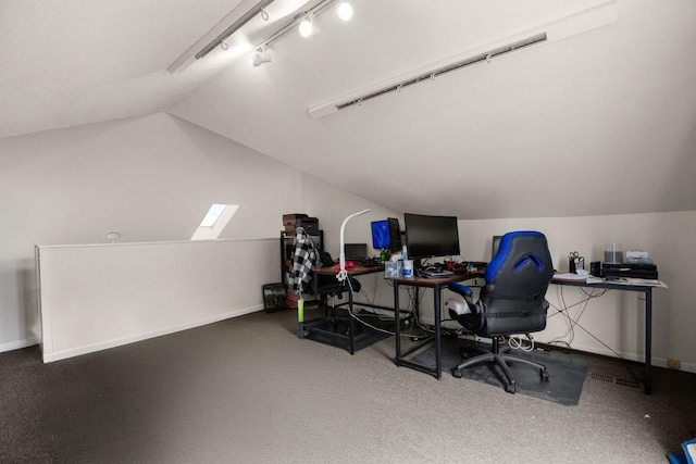 home office featuring vaulted ceiling, track lighting, and baseboards