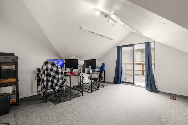 home office with carpet, visible vents, vaulted ceiling, a textured ceiling, and baseboards