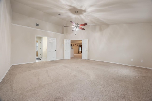 unfurnished room with ceiling fan, high vaulted ceiling, light carpet, visible vents, and baseboards