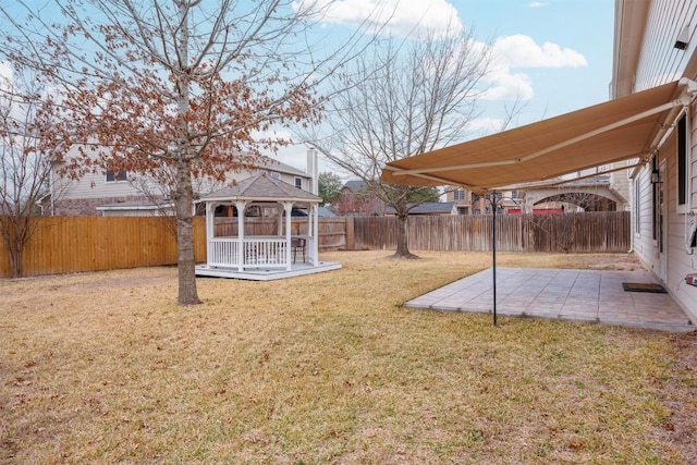 view of yard with a gazebo, a patio, and a fenced backyard