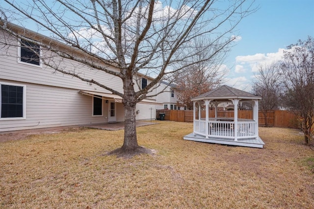 view of yard featuring a patio area, a fenced backyard, and a gazebo