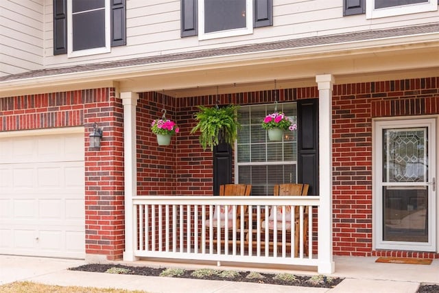 doorway to property with covered porch and brick siding