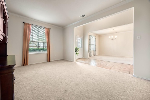 empty room featuring light carpet, light tile patterned floors, ornamental molding, and a notable chandelier