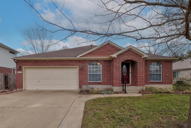 single story home with a garage, a front yard, concrete driveway, and brick siding