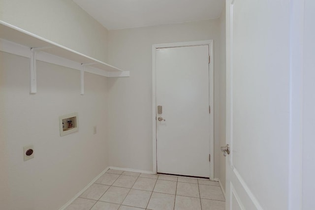 clothes washing area featuring washer hookup, light tile patterned floors, hookup for an electric dryer, laundry area, and baseboards