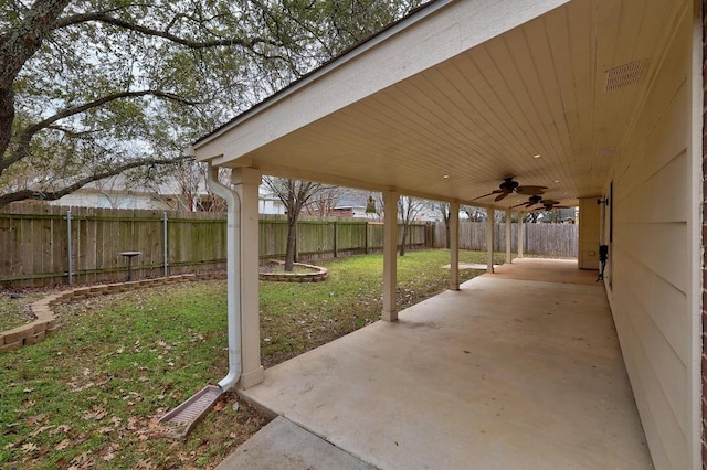 view of patio with a fenced backyard and ceiling fan