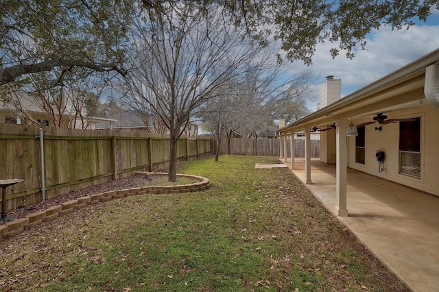 view of yard featuring a ceiling fan, a patio area, and a fenced backyard