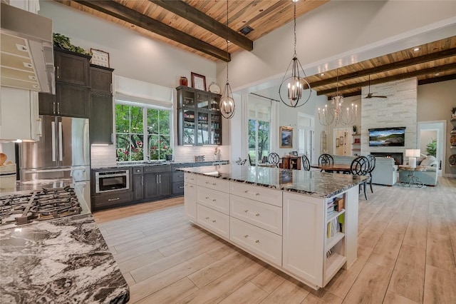 kitchen with stainless steel appliances, tasteful backsplash, wooden ceiling, and open shelves