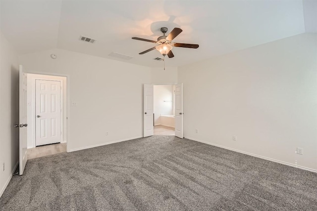 unfurnished bedroom featuring lofted ceiling, visible vents, a ceiling fan, carpet flooring, and baseboards