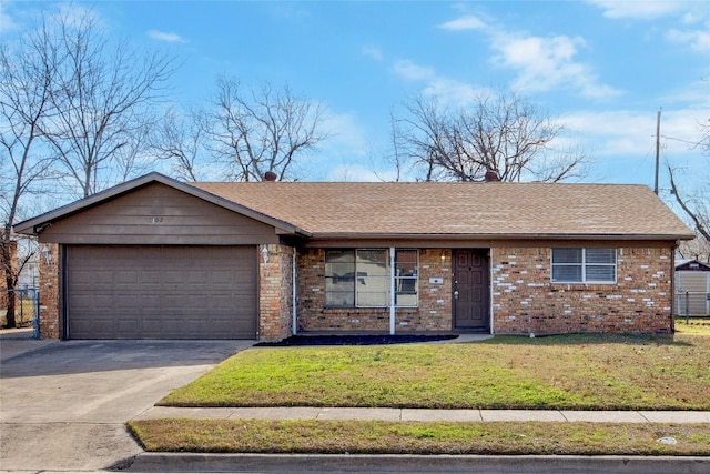 single story home featuring an attached garage, brick siding, driveway, roof with shingles, and a front lawn