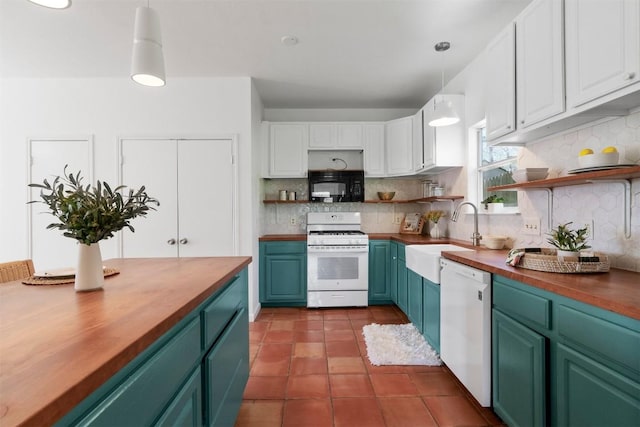 kitchen featuring white appliances, butcher block counters, open shelves, and a sink