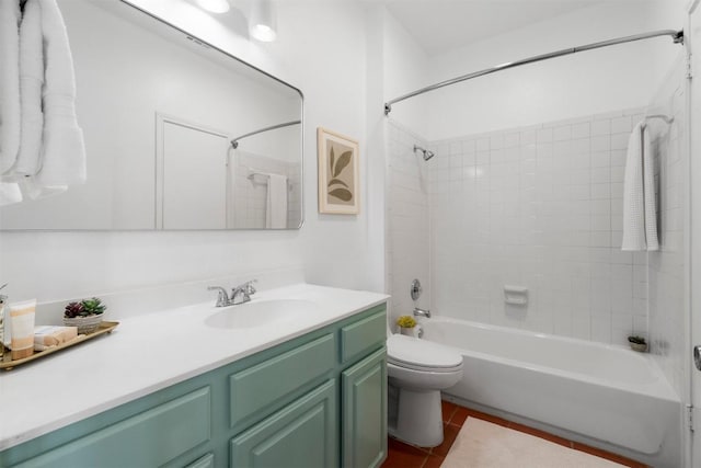 full bath featuring toilet, tile patterned flooring, bathing tub / shower combination, and vanity