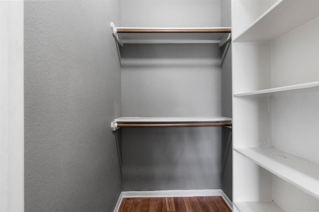 spacious closet with wood finished floors