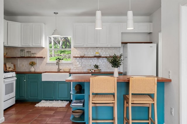 kitchen featuring white appliances, butcher block counters, a sink, and open shelves