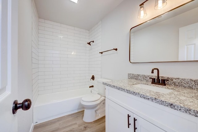 full bath featuring shower / bathtub combination, vanity, toilet, and wood finished floors