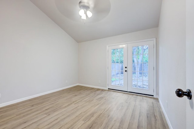 unfurnished room with french doors, ceiling fan, vaulted ceiling, wood finished floors, and baseboards