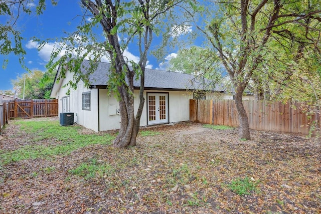 rear view of property with french doors and a fenced backyard