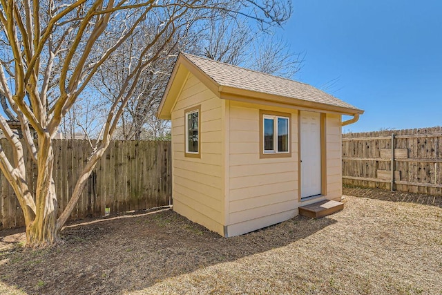 view of shed with a fenced backyard