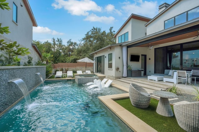 view of pool featuring a fenced in pool, a patio, ceiling fan, fence, and an in ground hot tub