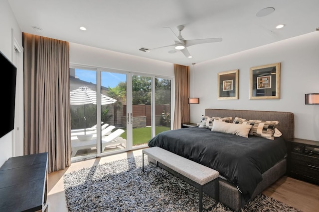 bedroom featuring recessed lighting, wood finished floors, a ceiling fan, visible vents, and access to exterior