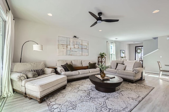 living room with recessed lighting, baseboards, ceiling fan, and wood finished floors