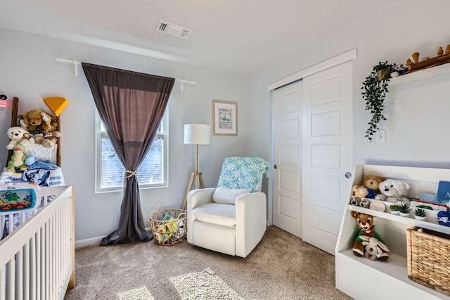 bedroom with carpet, visible vents, and a closet