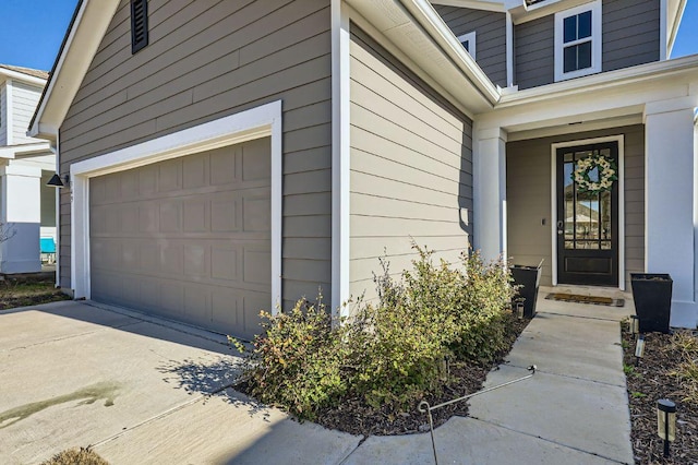 entrance to property featuring a garage