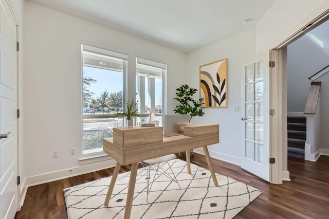 office space featuring wood finished floors and baseboards