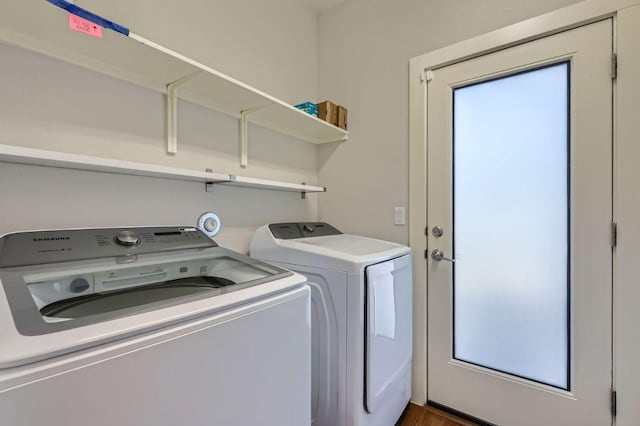 clothes washing area featuring laundry area and washer and dryer