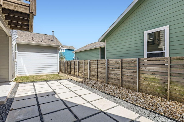 view of patio / terrace featuring fence