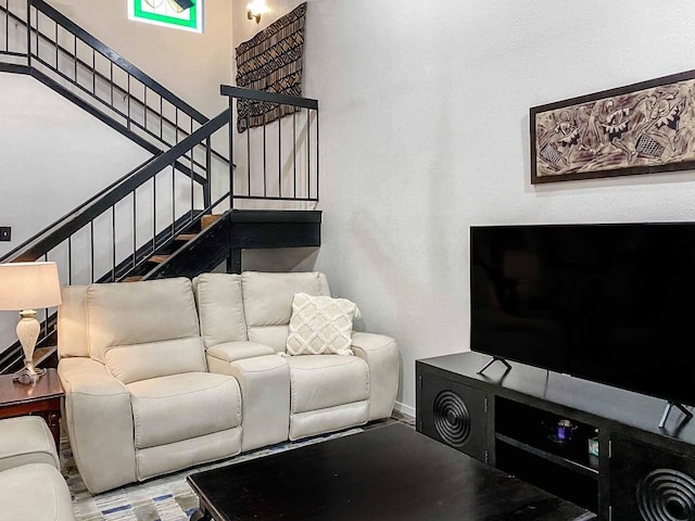 living room featuring stairway