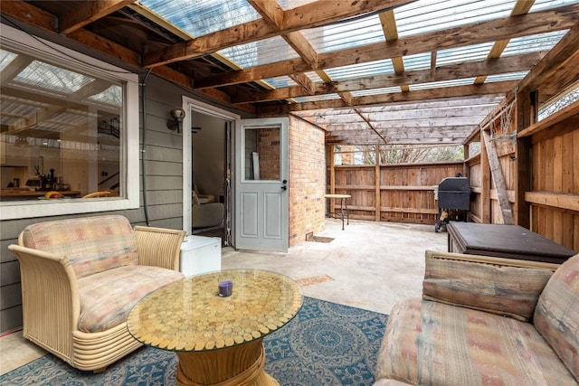 interior space featuring fence, area for grilling, and a pergola