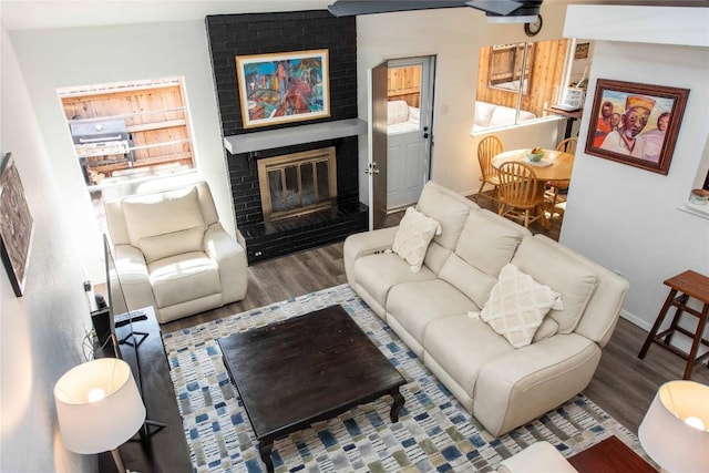 7215 Coronado Cir, Austin, TX 78752 - living area featuring wood finished floors and a fireplace