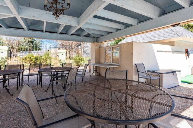 view of patio / terrace featuring outdoor dining space and fence