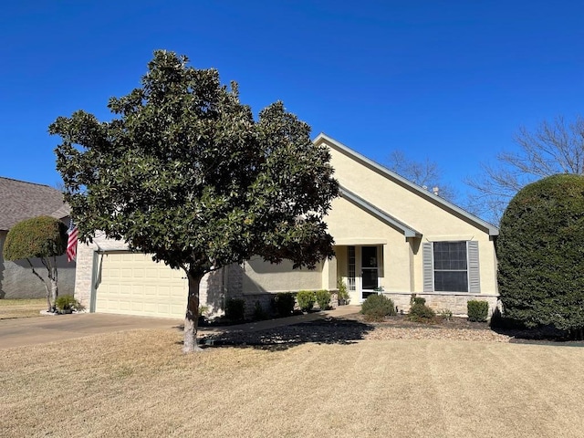 view of front facade with a garage, stone siding, concrete driveway, and stucco siding