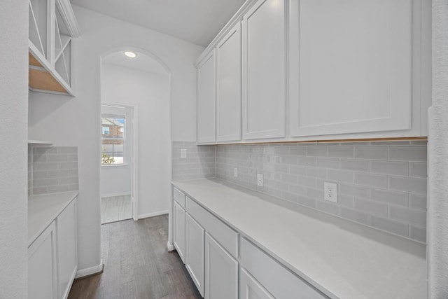 kitchen with tasteful backsplash, white cabinetry, open shelves, and light countertops