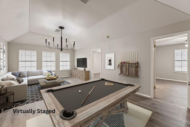 playroom featuring lofted ceiling, pool table, an inviting chandelier, wood finished floors, and baseboards