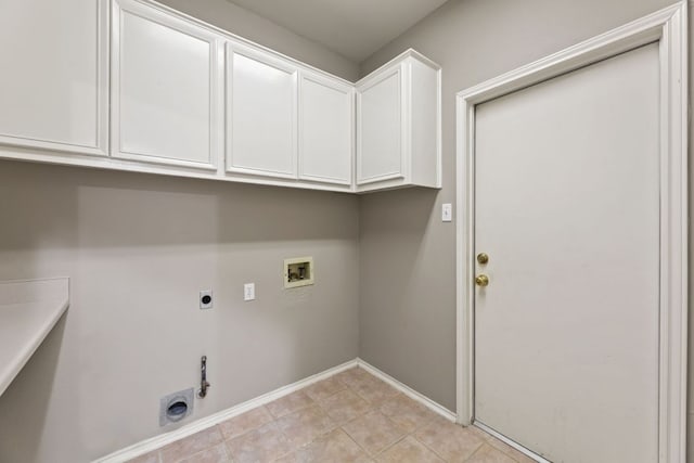 laundry room with washer hookup, cabinet space, hookup for an electric dryer, gas dryer hookup, and baseboards