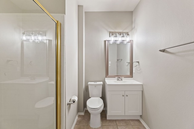 full bath featuring toilet, vanity, baseboards, tile patterned floors, and a stall shower