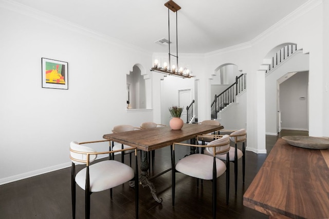 dining room with stairway, an inviting chandelier, dark wood-style floors, and visible vents