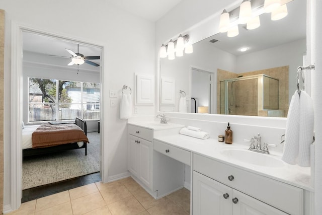 ensuite bathroom with tile patterned floors, visible vents, a sink, a shower stall, and double vanity