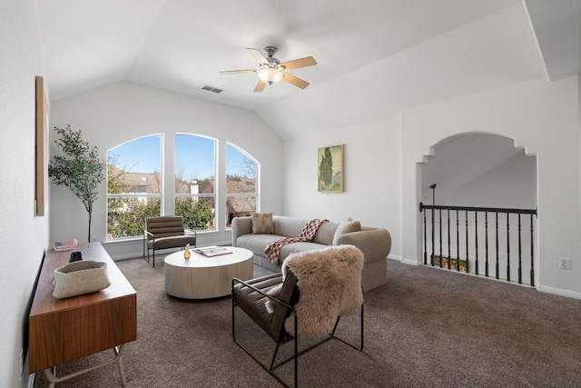 carpeted living room with vaulted ceiling, visible vents, and ceiling fan