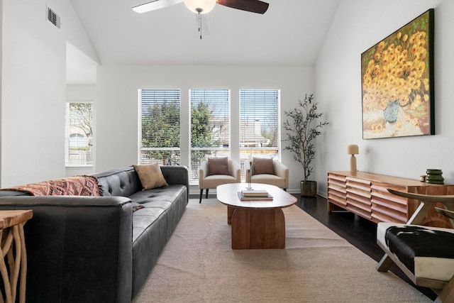 living area with visible vents, a healthy amount of sunlight, ceiling fan, and wood finished floors