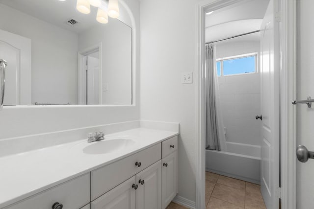 bathroom with tile patterned flooring, shower / tub combo, vanity, and visible vents