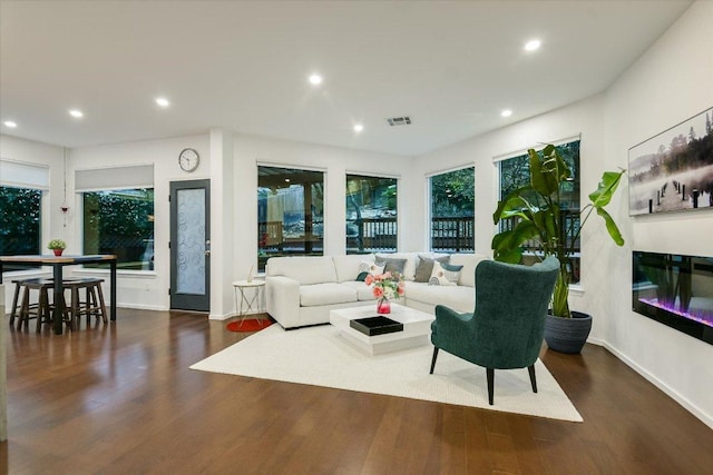 5908 Taylor Draper Cv, Austin, TX 78759 - living area featuring wood finished floors, recessed lighting, and a glass covered fireplace