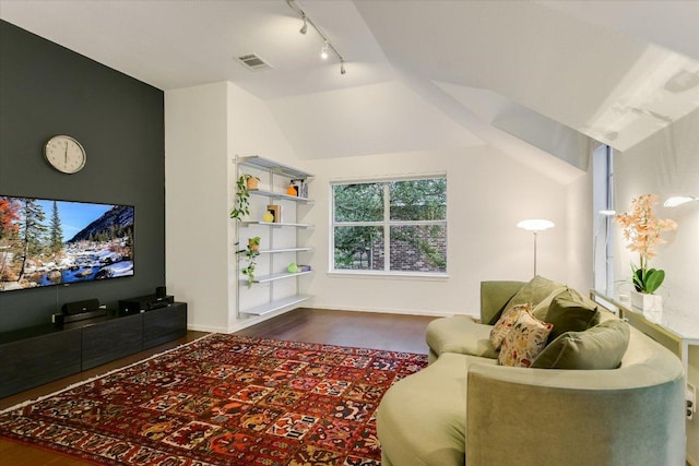5908 Taylor Draper Cv, Austin, TX 78759 - living room with rail lighting, dark wood-type flooring, and lofted ceiling