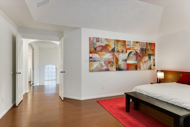 5908 Taylor Draper Cv, Austin, TX 78759 - bedroom with arched walkways and wood finished floors