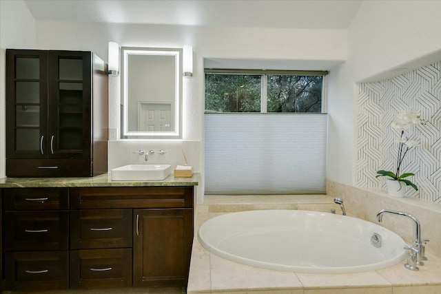 5908 Taylor Draper Cv, Austin, TX 78759 - bathroom featuring vanity and a garden tub