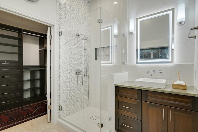 5908 Taylor Draper Cv, Austin, TX 78759 - bathroom with vanity, a stall shower, and tile patterned flooring